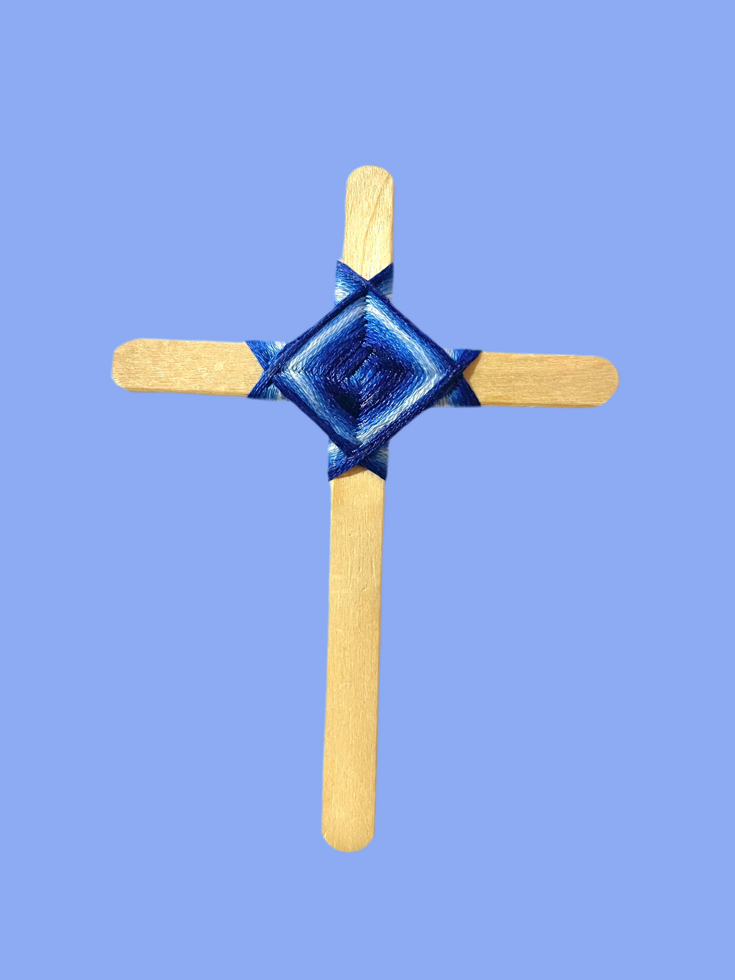 Cross popsicle sticks with God’s eye craft.